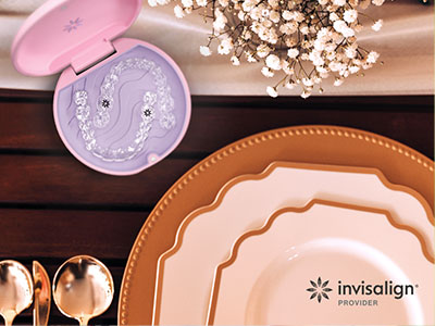 The image features a table setting with various plates, a box of contact lenses, and other items on a wooden surface.
